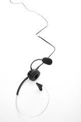 a black headset on white background