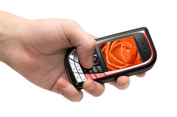 Mobile phone in a hand isolated on a white background.