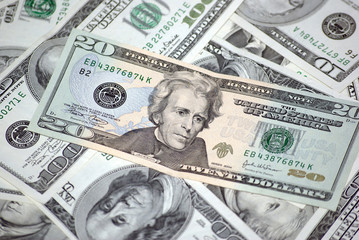 Close-up of Twenty Dollar Bill with Andrew Jackson Portrait Surrounded by Various US Currency Denominations - American Money Cash Pile Showing Federal Reserve Notes for Financial Concepts