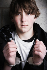 teen in handcuffs portrait close up