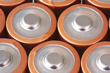 Batteries in close-up, forming a full-frame background.