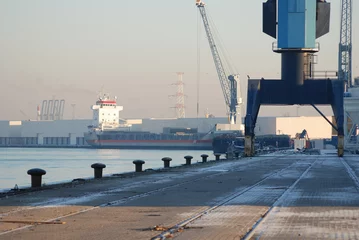 Foto op Canvas Crane and ship in the port of Antwerp © danieldefotograaf