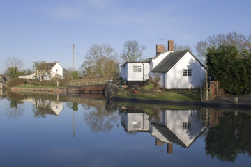 Fototapeta na wymiar Houses next to lake or river or canal.