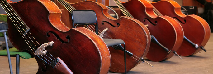 Vintage, music instruments, four old bass viols © Astroid