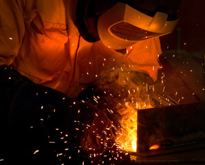 A tradesman welding steel - 6240119