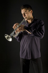Man in shirt trumpet easy melody. He have closed eyes. 