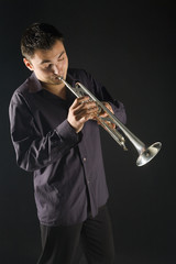 Man in shirt trumpet easy melody. Front view.