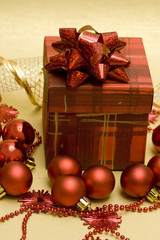 Fototapeta na wymiar beautiful red Christmas ball and gift box