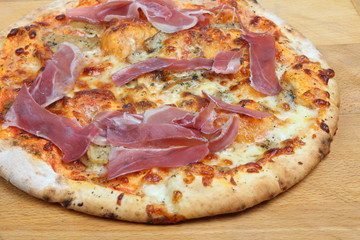 Pizza with parma ham and porcini mushrooms