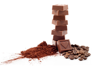 stack of chocolates and cocoa isolated on white