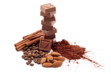 stack of chocolates and cocoa isolated on white