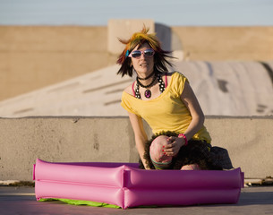 Portrait of a Punk Girl with Big Sunglasses Outdoors 