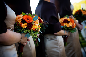 A brides wedding bouquet of flowers being held