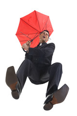 Young, screaming businessman with umbrella