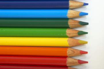 Coloured pencil crayons isolated on a white background