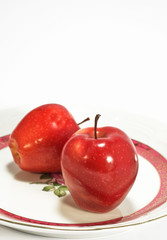 red apples on plate