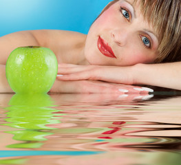 Woman  with juicy green apple