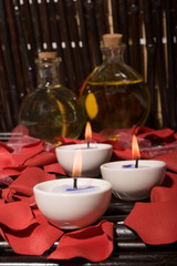 Fototapeta na wymiar Essential body massage oils and candles