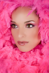pretty model with bright makeup wearing pink boa