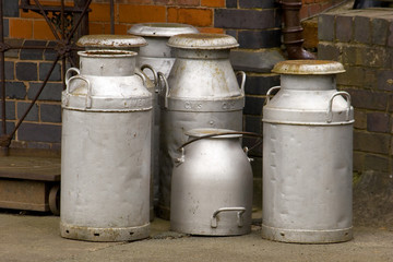 Milk churns waiting for collection on the station platform