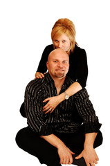 Young couple sitting on the floor.