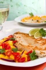 Fried skate (ray) with mango, cherry tomato red onion salsa