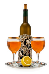 Bottle of wine in a silver support and two filled glasses
