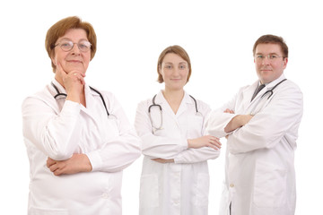 Fototapeta premium Senior female doctor and two young interns