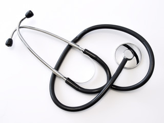 The medical stethoscope at the white table