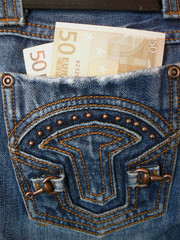 Money in pocket jeans. 100 euro