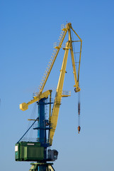 Port of Murmansk. Working crane. Sunlight.