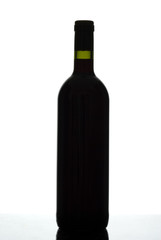 Silhouette of red wine bottle isolated on white.