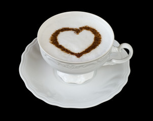 Coffee cappuccino cup with cinnamon heart shape on black
