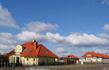 New, beautiful homes and blue sky. Poland.