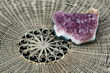 Crystals of amethyst on a wattled metal tray