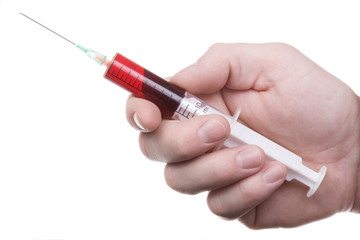 man's hand holds syringe with red liquid. Isolated on white.