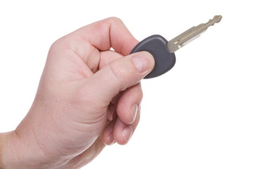 The man's hand holds key for the new car. Isolated on white.