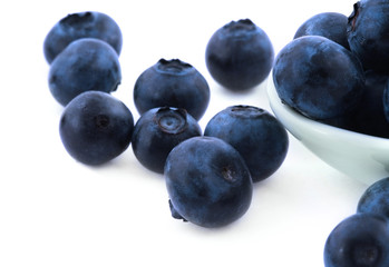 blueberries on white background, natural shadow underneath..