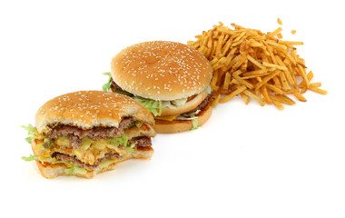 french fries and hamburgers against white background