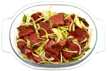 meat with onion on a glass plates