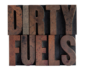 the phrase 'dirty fuels' in ink-stained letterpress wood type