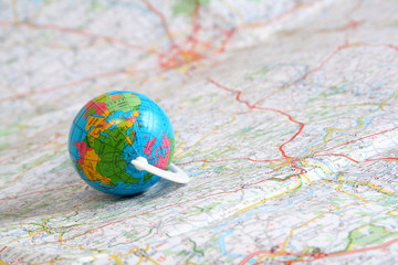 globe on background of map