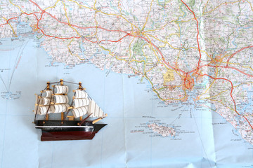 Model of ship on background of map
