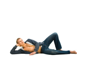 Young man lying and dreaming on isolated background