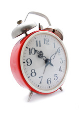 Old red alarm clock on a white background
