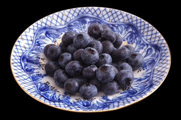Blueberries on a porcelain plate