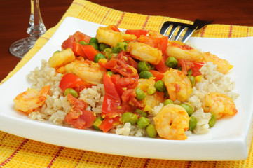 Plate of saffron shrimp served with rice.
