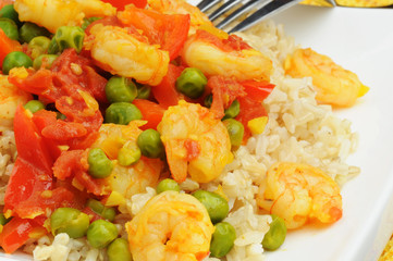 Shrimp infused with saffron served over rice.