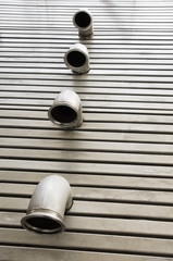 Pipes in a stainless steel metal floor