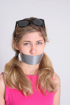 Blond woman gagged with duct tape